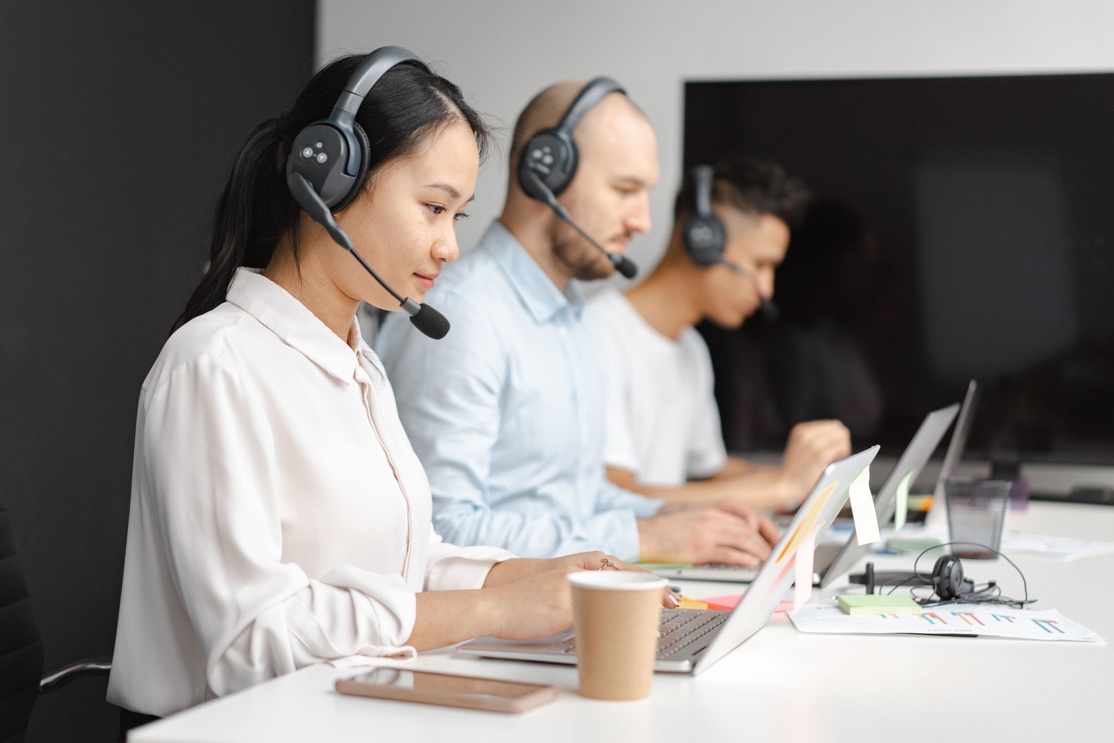 RDX support: real people with headsets ready to help Support specialists wearing headsets assisting customers at laptops
